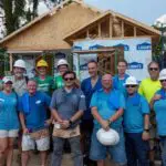 Grubb Properties team on construction site volunteering at the 300th NC Habitat for Humanities Home