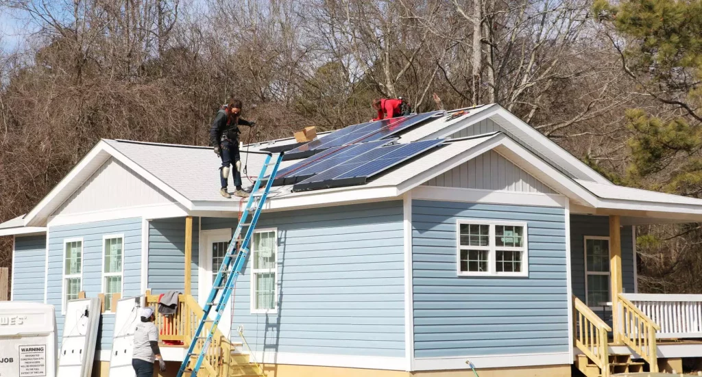 Southern Energy Management solar technicians installing a solar system on a Habitat for Humanity Home