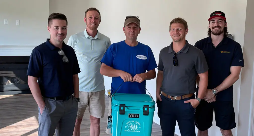 Rick and team from Mattamy Homes with Taylor and Noah from Southern Energy Management during the presentation of the Shine Champ award