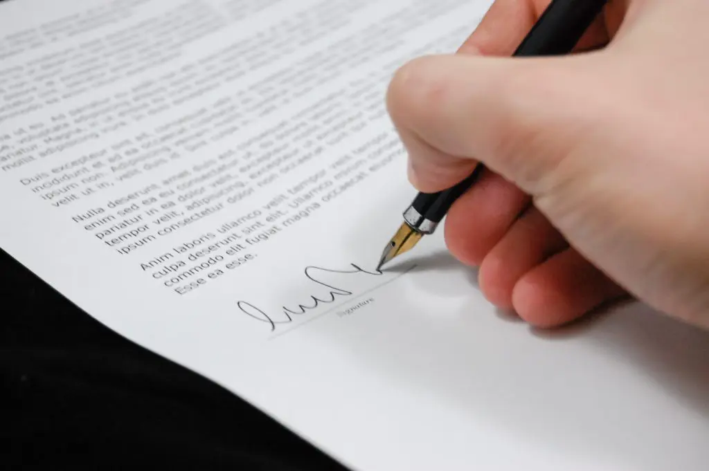 Signing a contract on a home sold at a price premium.