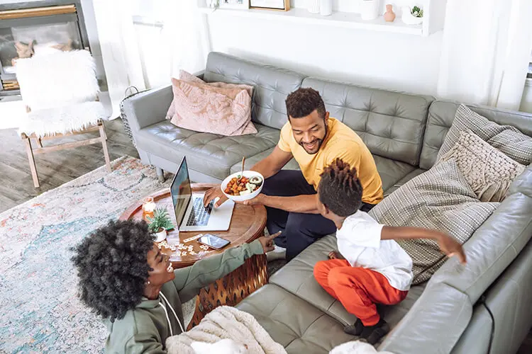 A family comfortably relaxing in their living room