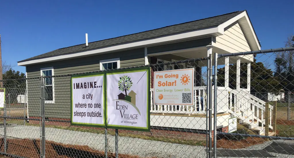 Eden Village model home with "I'm going solar sign"