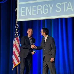 Taylor accepting the Energy Star Partner of the Year Award on stage