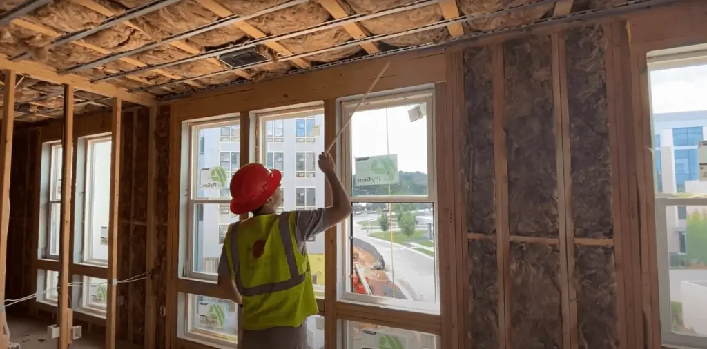 Multifamily services team inspects building performance on site during construction