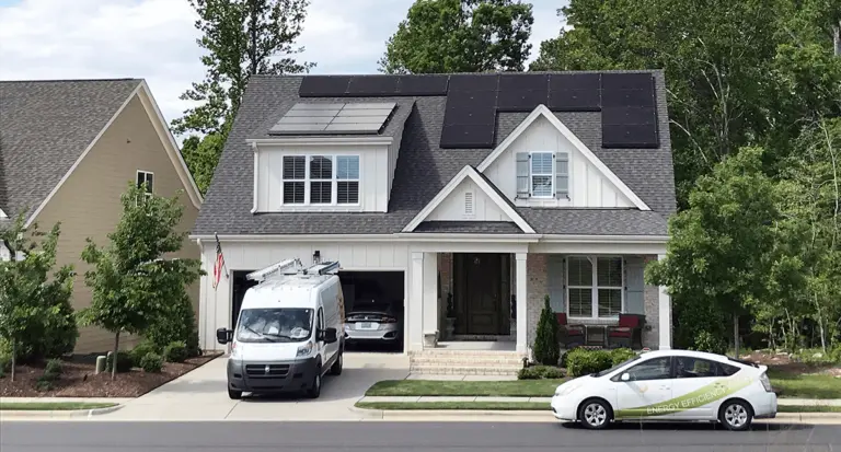 New home with black solar panels on the roof